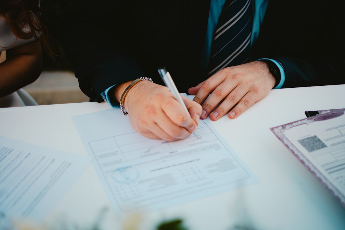 Professional reviewing paperwork at a desk